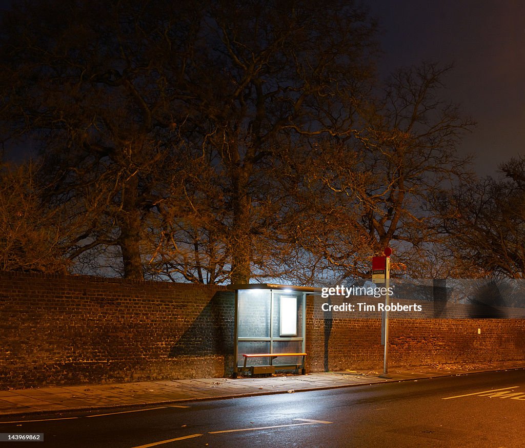 Bus stop at night in London.