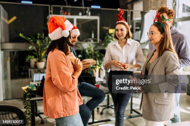 secret santa - christmas office party stock pictures, royalty-free photos & images