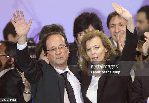 French President-Elect Francois Hollande and his partner Valerie Trierweiler greet thousands of gathered supporters at Place de la Bastille after...