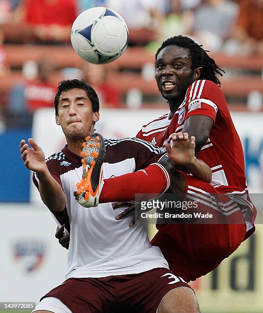 Ugo Ihemelu of the FC Dallas and Tony Cascio of the Colorado Rapids battle for control of the ball during the first half of a soccer game at FC...