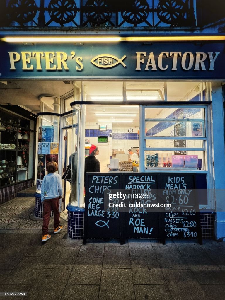 Old Chip Shop Exterior Of Traditional English Fish And Chip Shop With Customers ...