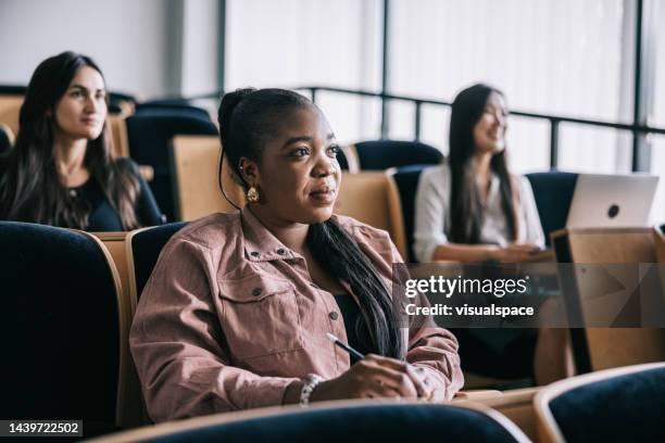 positive minded student, attending university seminar - social distancing classroom stockfoto's en -beelden