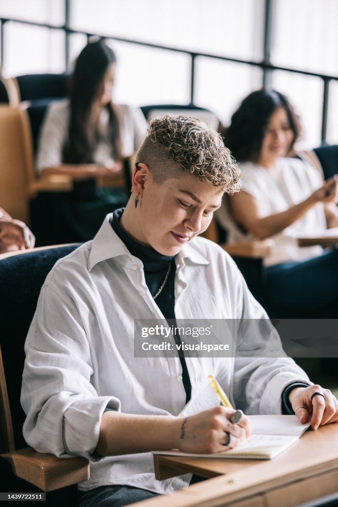 Student Notes From Lecture Student Taking Notes From University Lecture High-Res Stock Photo ...