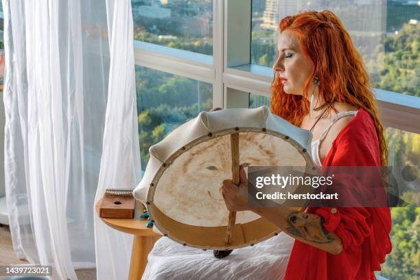 shamanic woman ritually invokes good spirits - witch doctor tattoo stock pictures, royalty-free photos & images