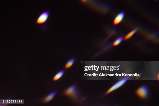 Colourful rainbow disco ball light leaks texture on black background Colourful rainbow disco ball light leaks texture on black background