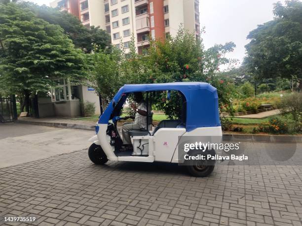 Cheaper electric version of the Tuk Tuk driven by a auto rickshaw driver on October 3, 2022 in Mysuru, India. The driver complains of limited...