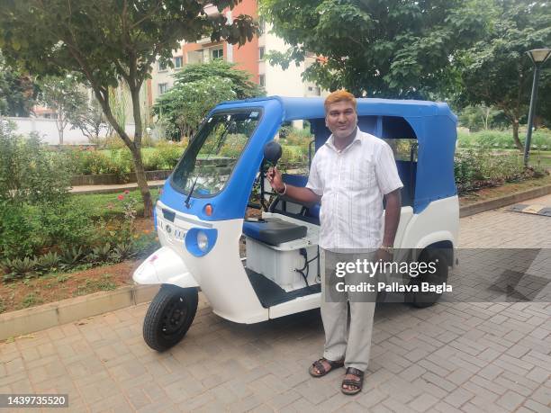 Cheaper electric version of the Tuk Tuk driven by a auto rickshaw driver on October 3, 2022 in Mysuru, India. The driver complains of limited...