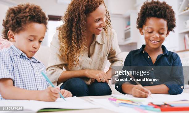 children, drawing and learning art with pencil in book and mother helping with homework, education and writing. happy black family and woman teacher with kids for lesson on creativity development - summer school stock pictures, royalty-free photos & images
