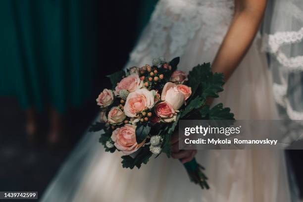 beautiful bouquet of roses and oak leaves. - pink wedding dress stock pictures, royalty-free photos & images