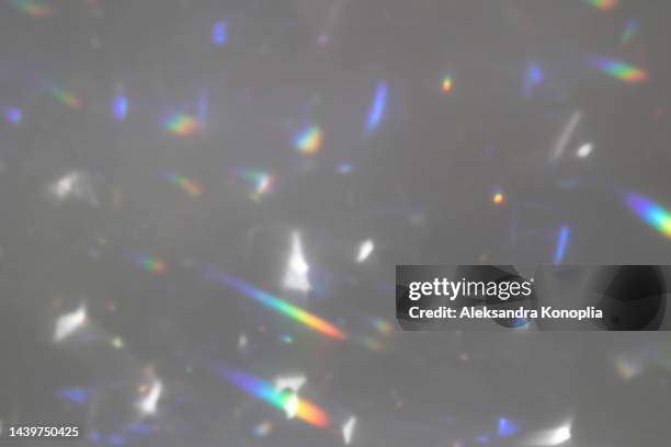 dreamy surreal rainbow crystal disco ball light refraction texture overlay effect - caustica ottica foto e immagini stock