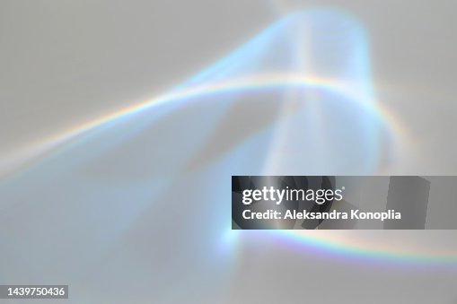 Surreal rainbow laser light refraction texture overlay effect on white wall Surreal rainbow laser light refraction texture overlay effect on white wall