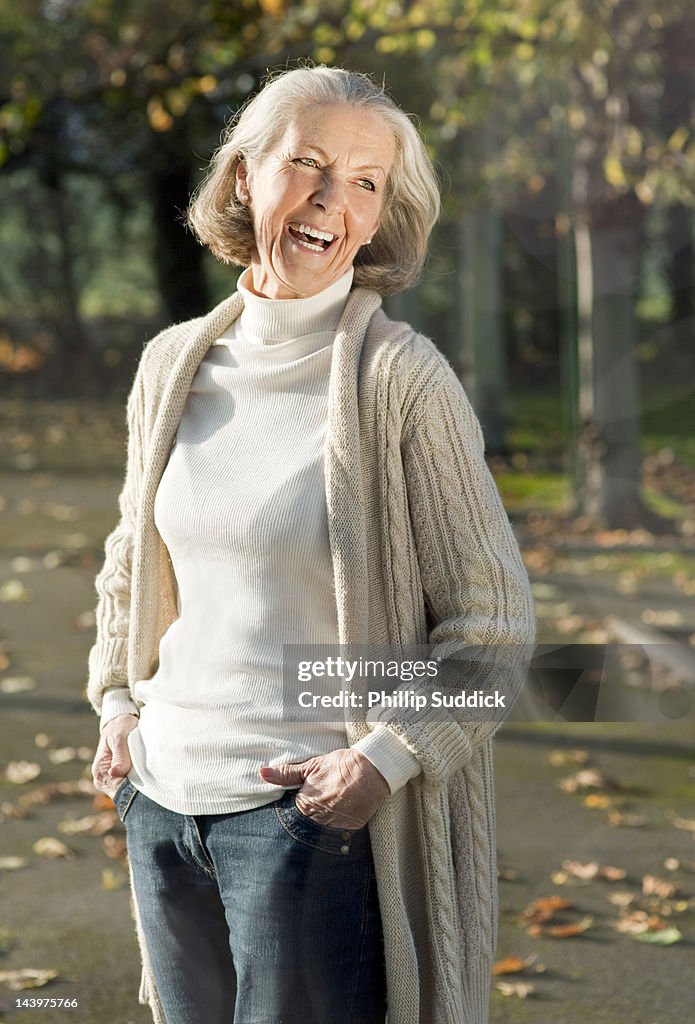 Mature lady in sunshine laughing