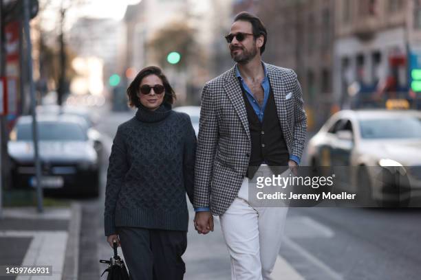 Patricia Wirschke is seen wearing brown Céline sunglasses, grey wool knit sweater from Odeeh and a grey matching Odeeh knit pants and black leather...