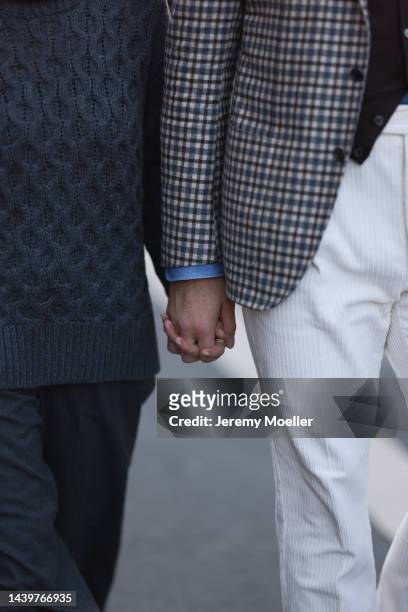 Patricia Wirschke is seen wearing grey wool knit sweater from Odeeh and a grey matching Odeeh knit pants; Clemens Wirschke is seen wearing blue...