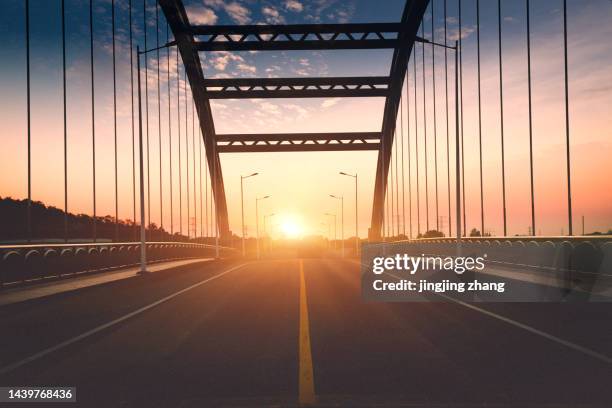 in the evening, the sun sets, and the high-speed kilometers through the arch bridge - ship's bridge stock pictures, royalty-free photos & images