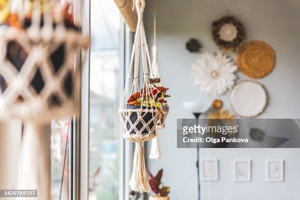 cozy home interior with craft woven accessories. - macrame stock pictures, royalty-free photos & images