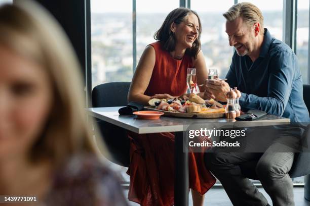 couple having meal together - 50s bar stock pictures, royalty-free photos & images