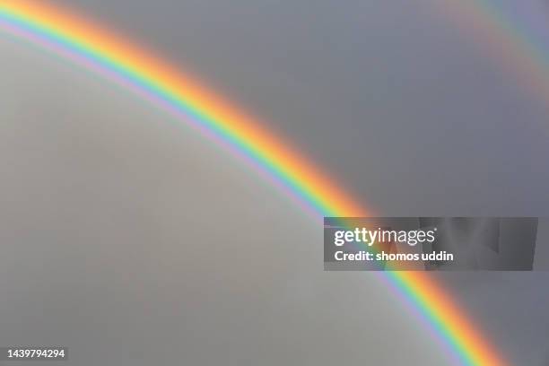 dramatic sky with rainbow - rainbow fotografías e imágenes de stock