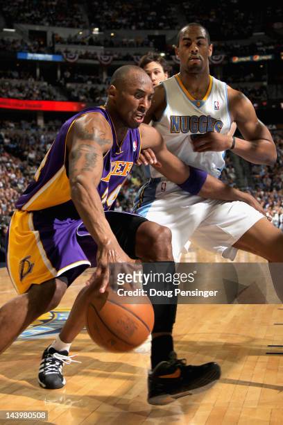 Kobe Bryant of the Los Angeles Lakers drives the ball against Arron Afflalo of the Denver Nuggets in Game Four of the Western Conference...