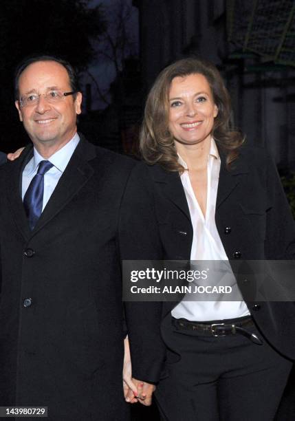 France's opposition Socialist Party candidate for the 2012 French presidential election Francois Hollande poses with his companion Valerie...