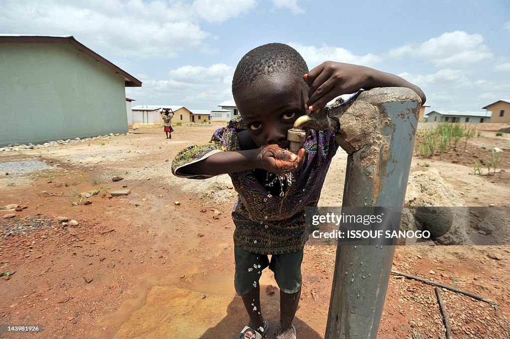 A boy drinks water from a tap on April 2