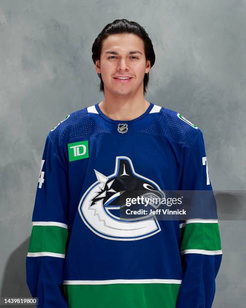 Ethan Bear of the Vancouver Canucks poses for his official headshot for the 2022-2023 season before their NHL game against the Nashville Predators at...