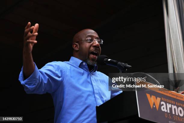 Democratic Senate Candidate Raphael Warnock gives a speech to supporters during a Get Out the Vote rally at Bearfoot Tavern on November 07, 2022 in...