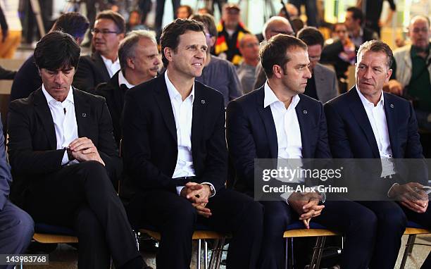 Head coach Joachim Loew, team manager Oliver Bierhoff, assistant coach Hans-Dieter Flick and goalkeeper coach Andreas Koepke wait for the start of...