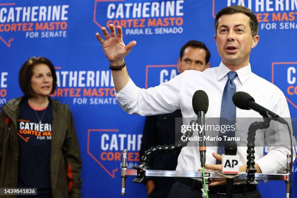 Transportation Secretary Pete Buttigieg speaks as Sen. Catherine Cortez Masto looks on at a canvass kickoff event on November 7, 2022 in Henderson,...