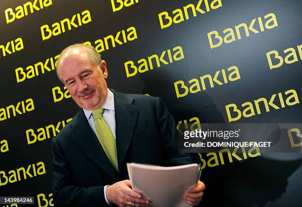 Bankia's Chairman Rodrigo Rato arrives to give a press conference to announce the 2011 annual results in Madrid on February 10, 2012. Spain's biggest...