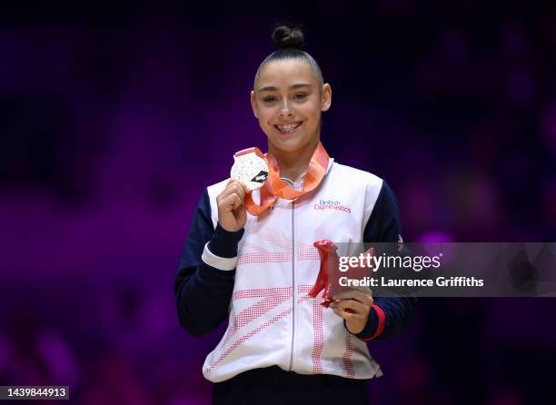 Jessica Gadirova of Team Great Britain celebrates on the podium after winning a gold medal in the Women's Floor Final on Day Nine of the FIG Artistic...