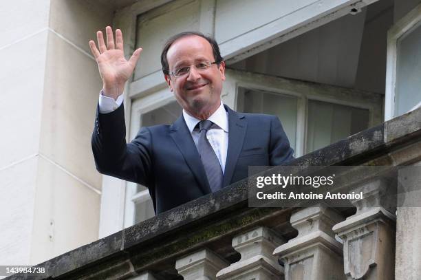 French President Francois Hollande waves from the balcony of the Socialist Party headquarters on May 7, 2012 in Paris, France. Socialist Francois...