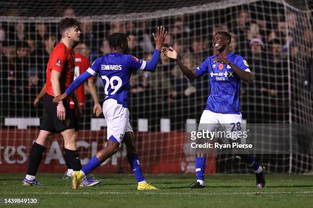 Panutche Camara of Ipswich Town celebrates scoring their team's third goal with teammate Kyle Edwards during the FA Cup First Round match between...
