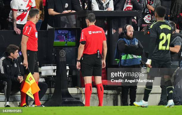 Match Referee, Juan Martinez Munuera checks the VAR screen for a penalty incident during the LaLiga Santander match between Rayo Vallecano and Real...