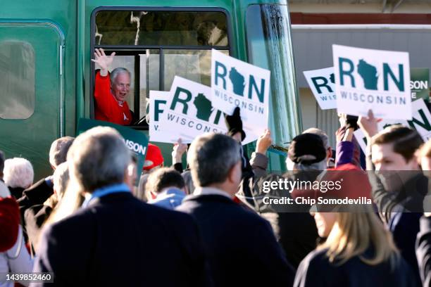 Sen. Ron Johnson waves from his campaign bus as he arrives at a rally at the Waukesha County Expo the day before Election Day on November 07, 2022 in...