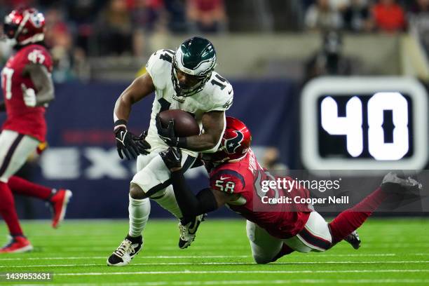 Christian Kirksey of the Houston Texans tackles Kenneth Gainwell of the Philadelphia Eagles at NRG Stadium on November 3, 2022 in Houston, Texas.