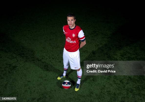 Robin van Persie poses during a photoshoot for the new Arsenal home