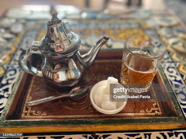 arabic teapot with tea cup and silver sugar bowl on table - mint sweet stock pictures, royalty-free photos & images