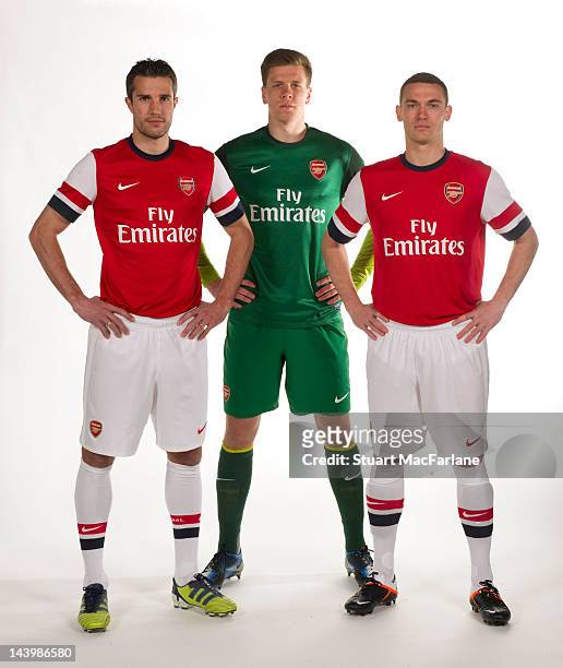 Robin van Persie, Wojciech Szczesny and Thomas Vermaelen pose during a photoshoot for the new Arsenal home kit for season 2012/13 at London Colney on...