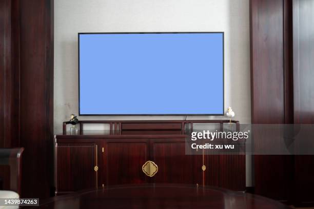 tv on solid wood tv cabinet - the oak room stock pictures, royalty-free photos & images