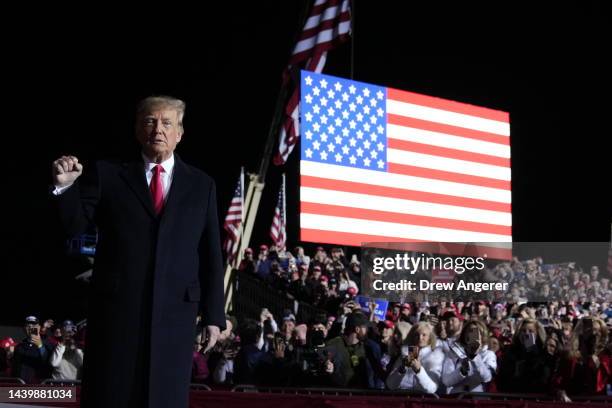 Former U.S. President Donald Trump greets supporters before a rally at the Dayton International Airport on November 7, 2022 in Vandalia, Ohio. Trump...