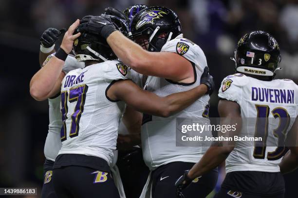 Kenyan Drake of the Baltimore Ravens celebrates withe teammates after running the ball for a touchdown during the second quarter against the New...