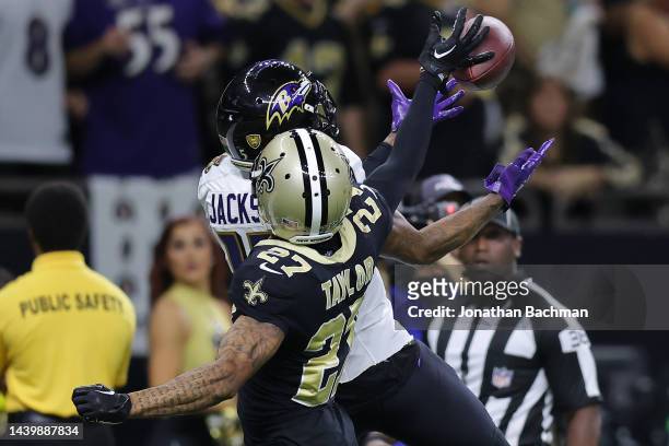 Alontae Taylor of the New Orleans Saints breaks up a pass intended for DeSean Jackson of the Baltimore Ravens during the second quarter at Caesars...