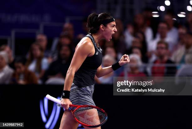 Caroline Garcia of France celebrates a point against Aryna Sabalenka of Belarus in their Women's Singles Final match during the 2022 WTA Finals, part...