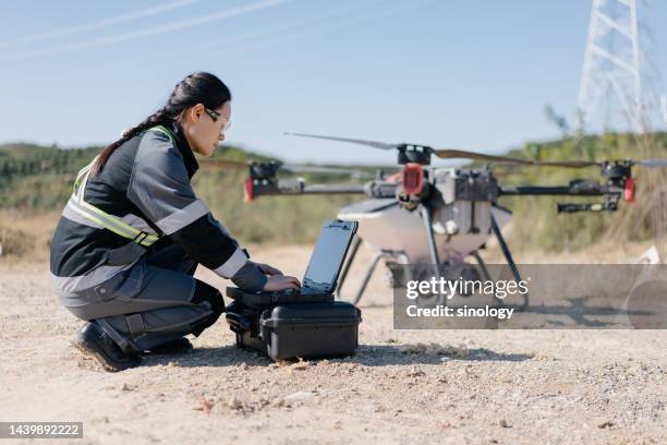 engineers are testing agricultural drones - drone technology stock pictures, royalty-free photos & images