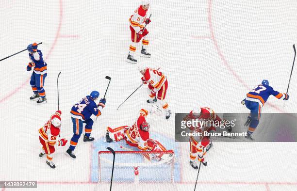 Anders Lee of the New York Islanders scores a third period goal against Jacob Markstrom of the Calgary Flames at the UBS Arena on November 07, 2022...