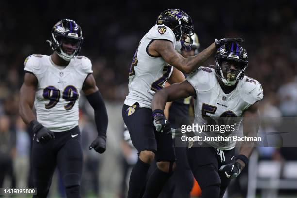 Justin Houston of the Baltimore Ravens celebrates with teammates after a sack during the fourth quarter against the New Orleans Saints at Caesars...