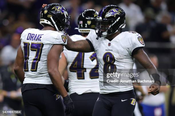 Kenyan Drake of the Baltimore Ravens celebrates with Lamar Jackson after running for a touchdown during the fourth quarter against the New Orleans...