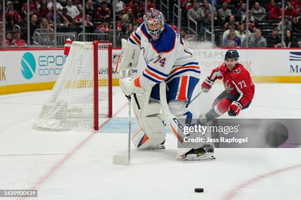 Stuart Skinner of the Edmonton Oilers clears the puck from Conor Sheary of the Washington Capitals during the second period of the game at Capital...