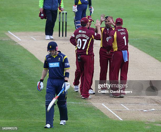 Chaminda Vaas of Northamptonshire celebrates with team mates after bowling Michael Thornely during the Clydesdale Bank Pro40 match between...